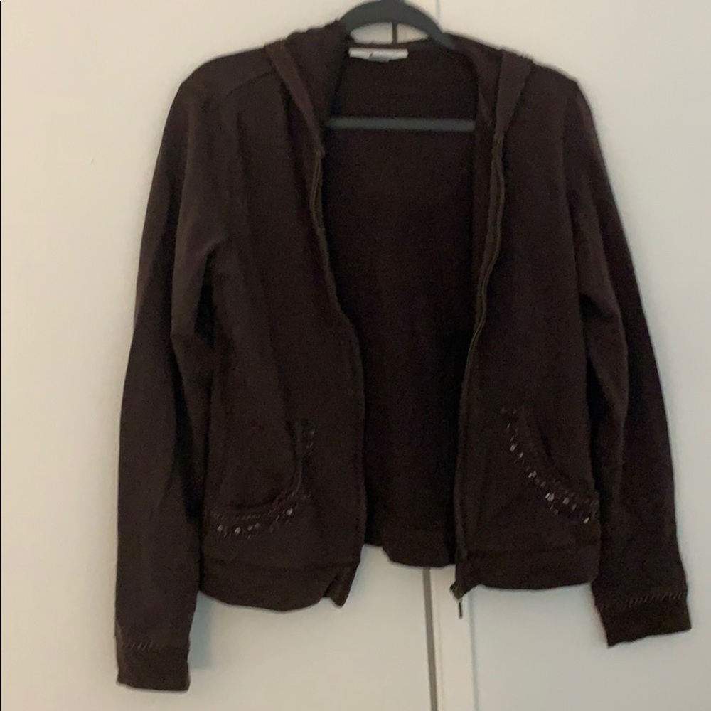 Brown light jacket. Slight jeweled border.